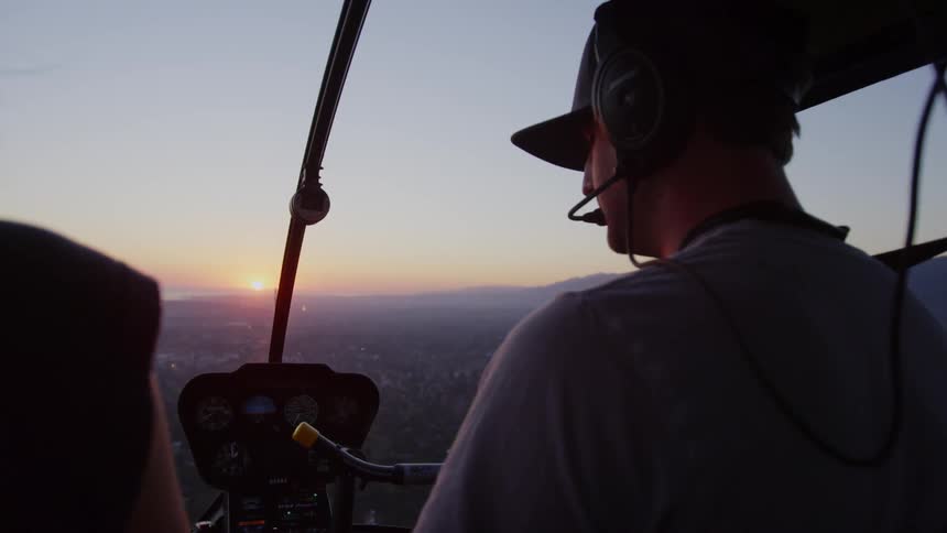 A man is flying a helicopter