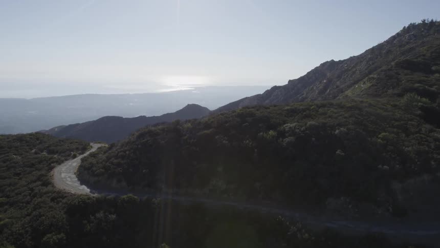 A road winds across a mountain
