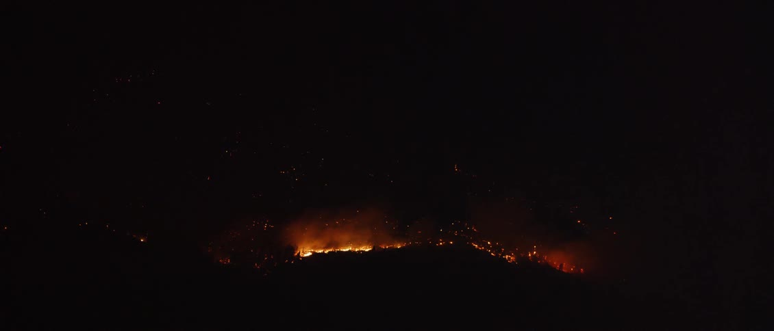 A fire burns on the mountain