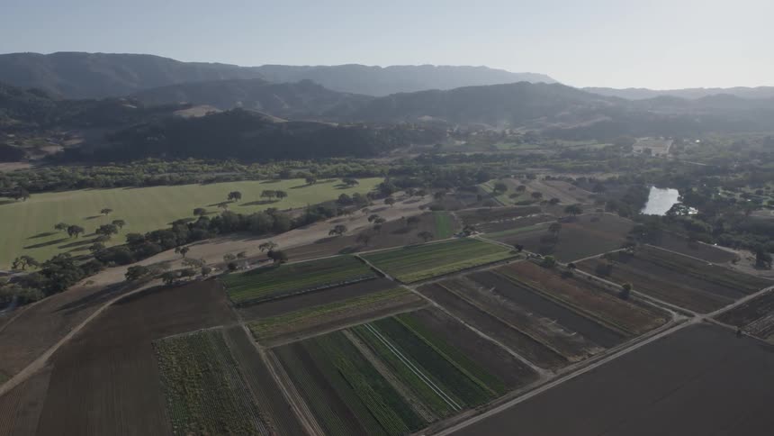 A farmland is shown from the sky