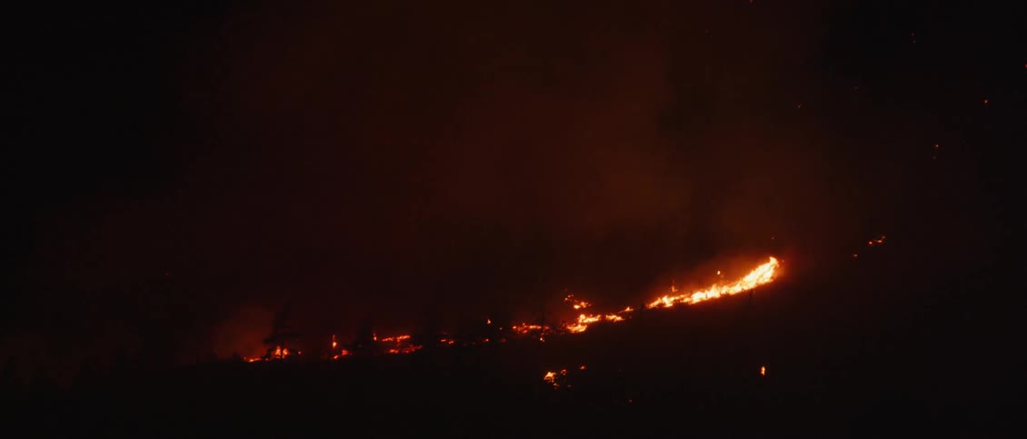 A wildfire burns in the mountains