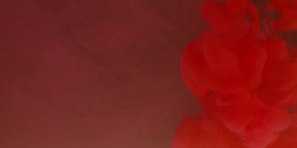 Red liquid is spreading in clear liquid
