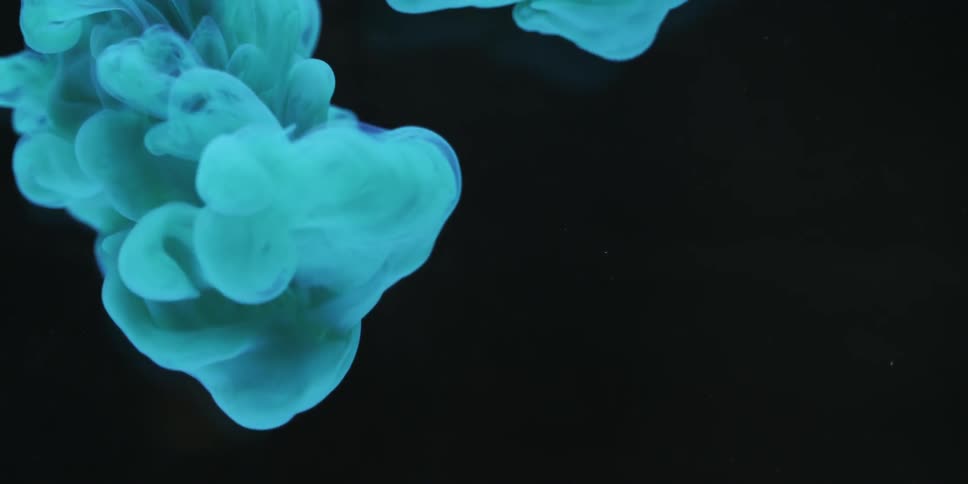 Blue liquid swirls down slowly