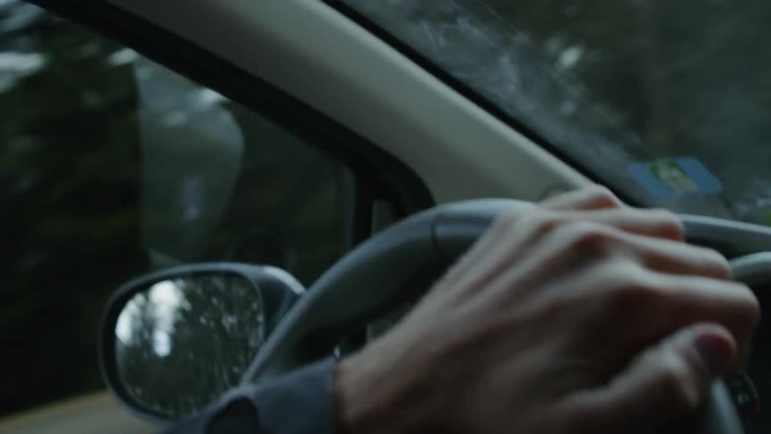 A driver steers a ford vehicle