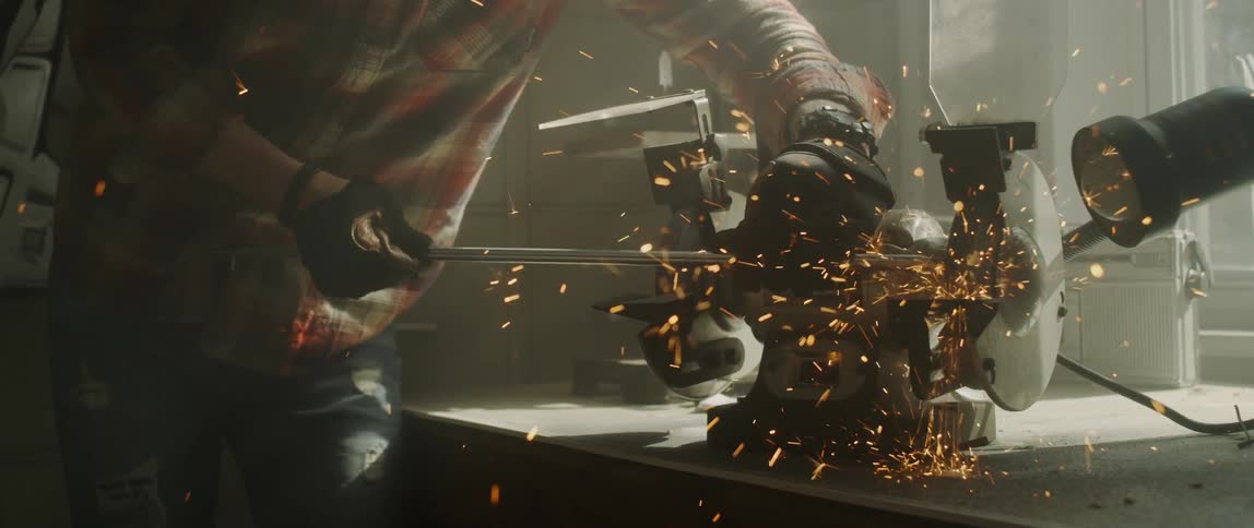 A man is milling a piece of steel
