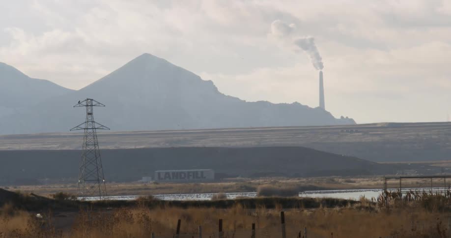Smoke pours out from a smoke stack