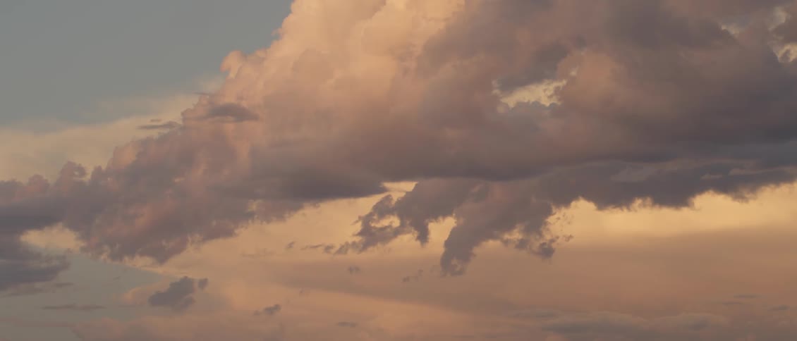 Clouds hang nearly still in the sky