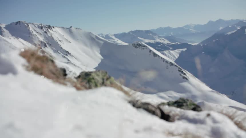 Sun shines down on snowy mountains
