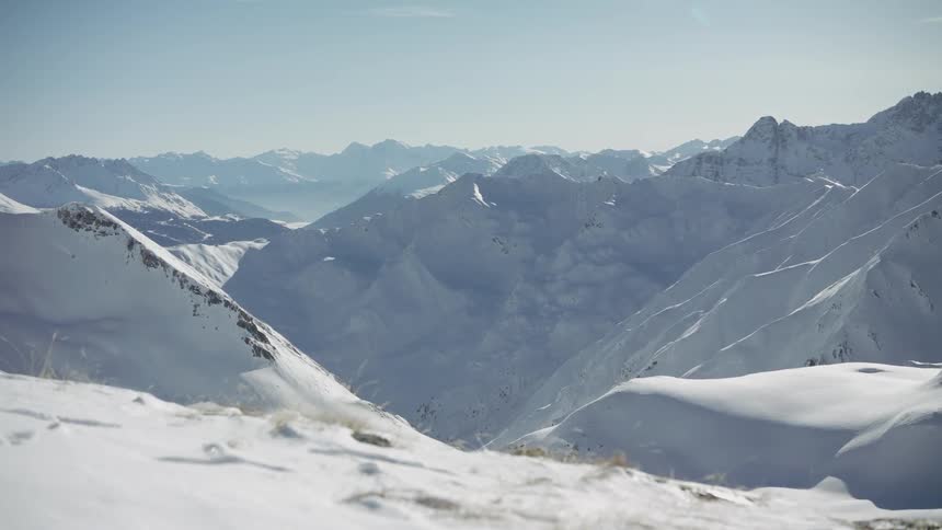 Sun shines down on snowy mountains