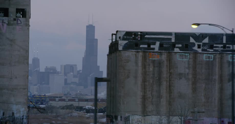City skyline behind dilapidated and abandoned buildings