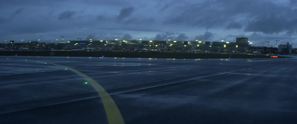 The runway is empty on a rainy day