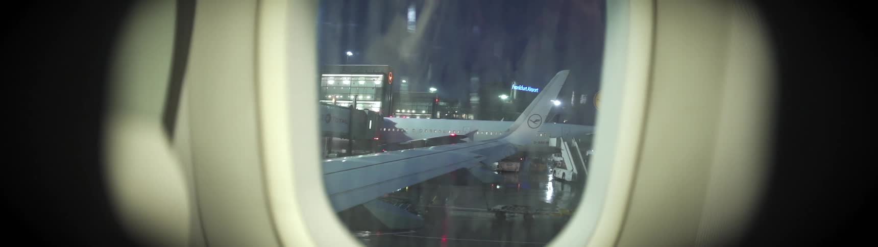 Rain falls onto a planes window