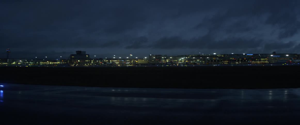 Buildings in a city lit up at night