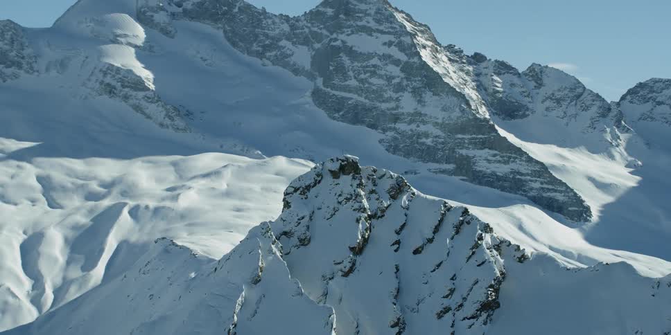 Circling the smaller Hohe Warte mountain peak with the Olperer mountain in the background