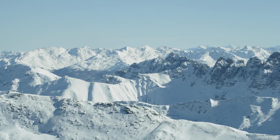 Snow covers the mountain landscape