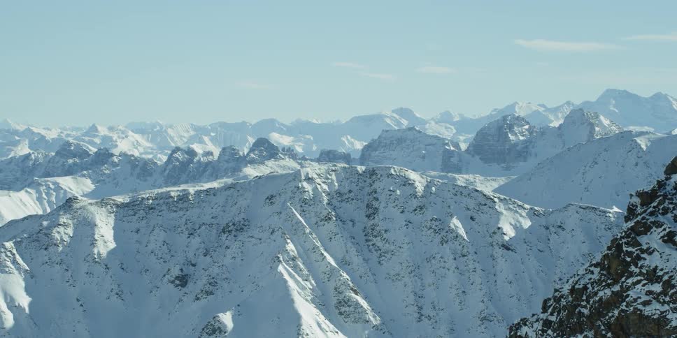 Sun shines down on snowy mountains
