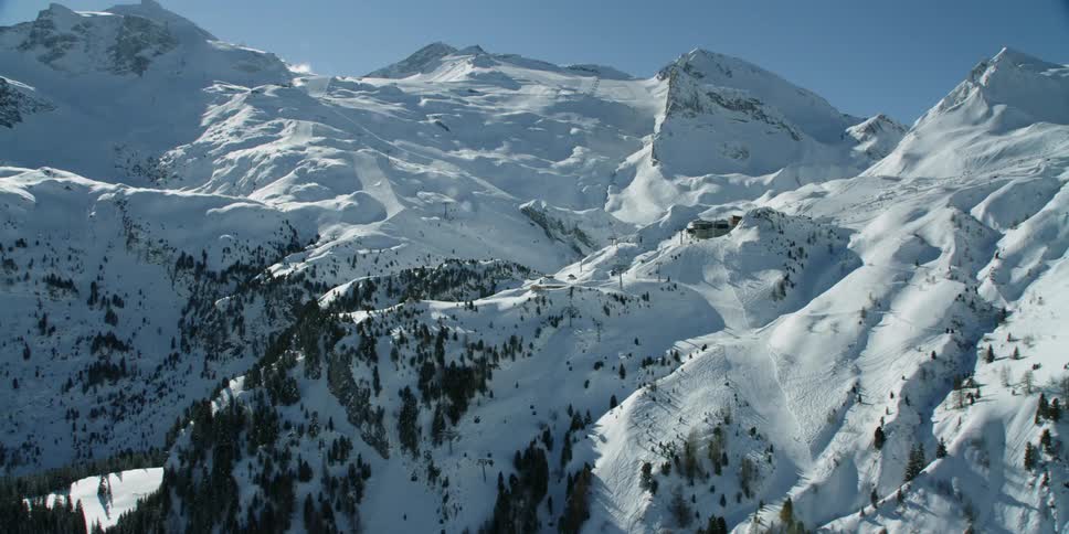 Sun shines down on snowy mountains