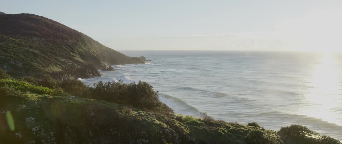 Waves crashing on a rocky cliff side
