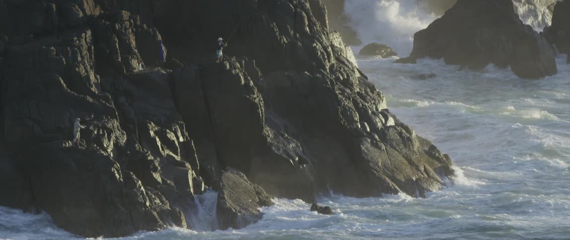 Waves are crashing against the rocks
