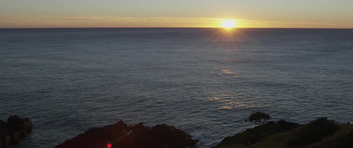 A steep coastline gives way to the ocean