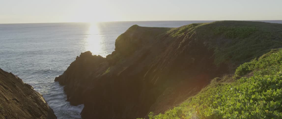 View of some green cliffs near the shore