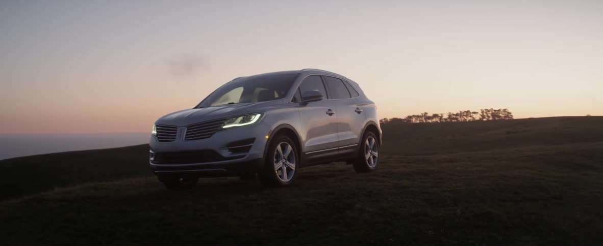 A person is parked on the field at dawn