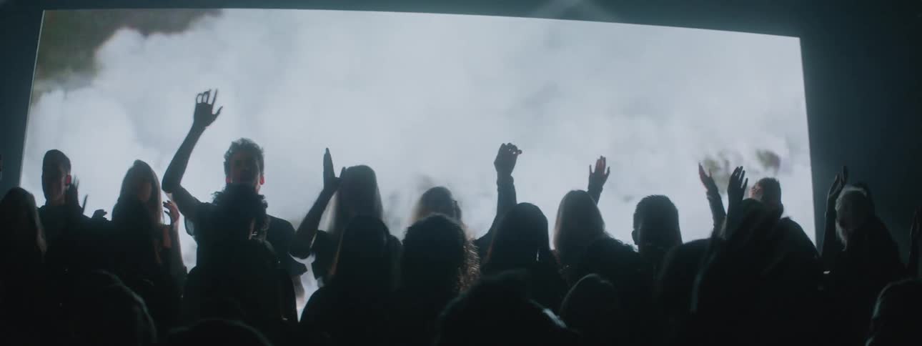 Lights shine on a performing choir