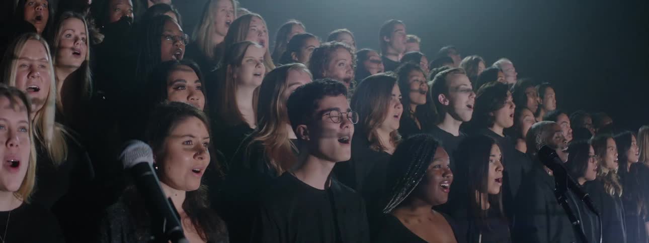 Lights strobe on a singing choir