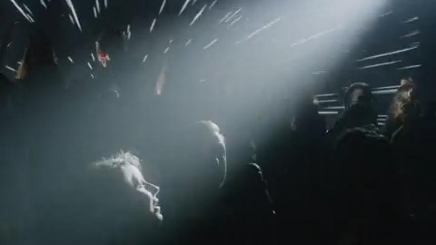 Spotlights shine on a performing choir