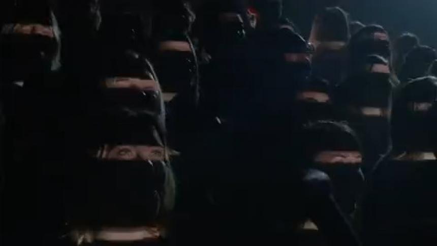 Lights strobe on a singing choir