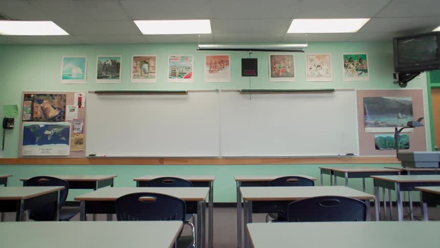 Lights are on in an empty classroom