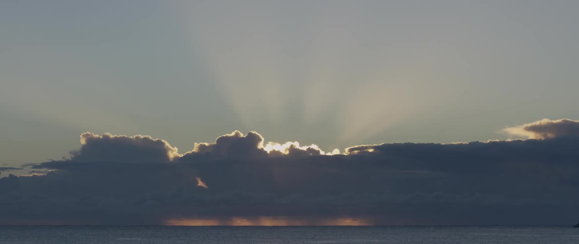 Sun rays behind clouds