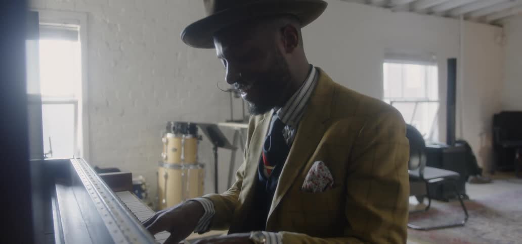 Man is playing the piano and singing