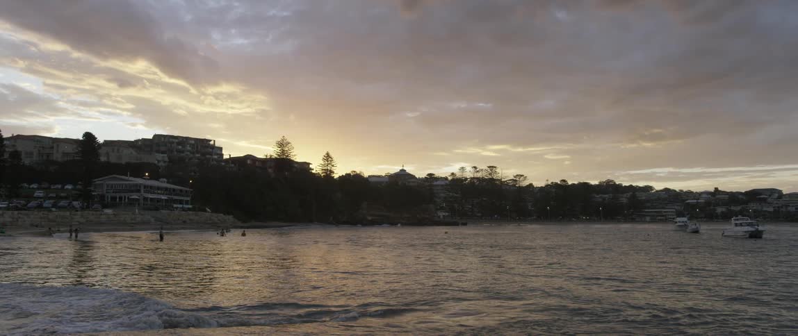Boats float on a choppy lake