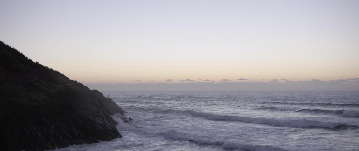 Ocean waves roll into shore