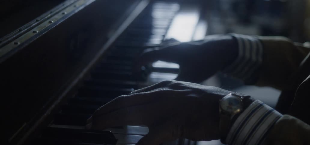 A man plays a piano