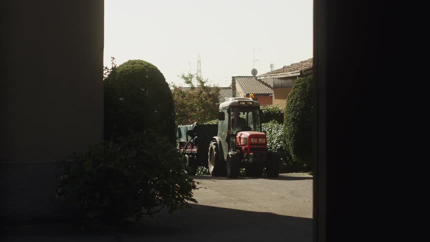 A tractor is driven on a farm