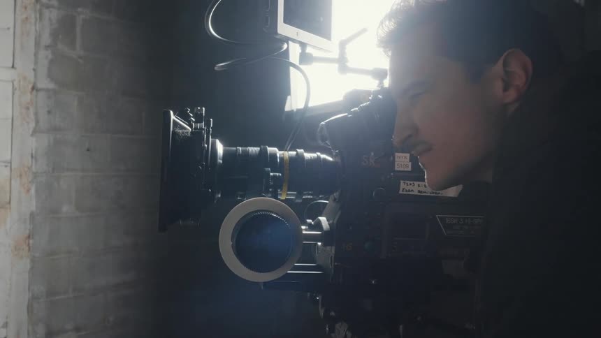 A man uses a video camera