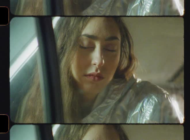 A sad looking woman glances down