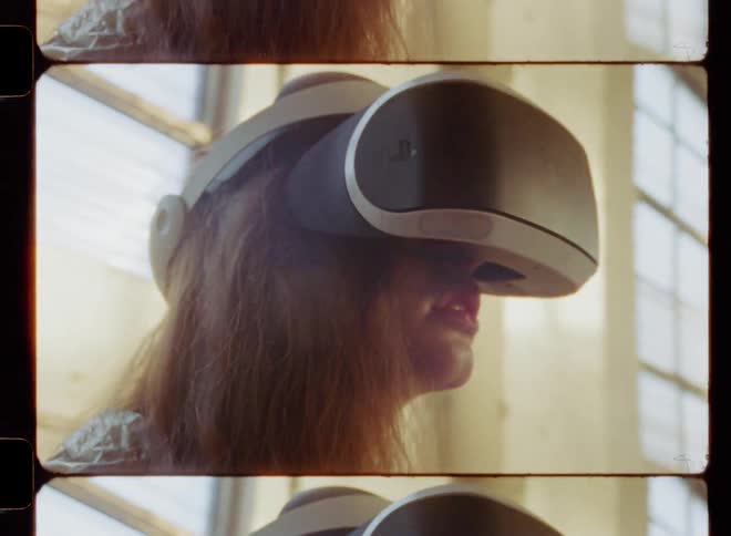 Woman in empty building is wearing a virtual reality headset