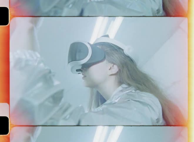 A woman is standing inside an abandoned building wearing a vr headset