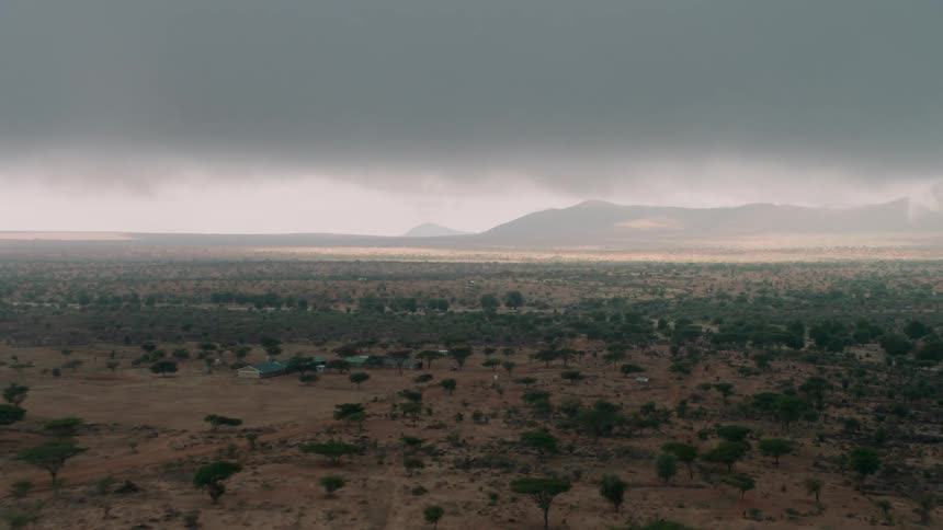 Dark clouds float above a rural landscape