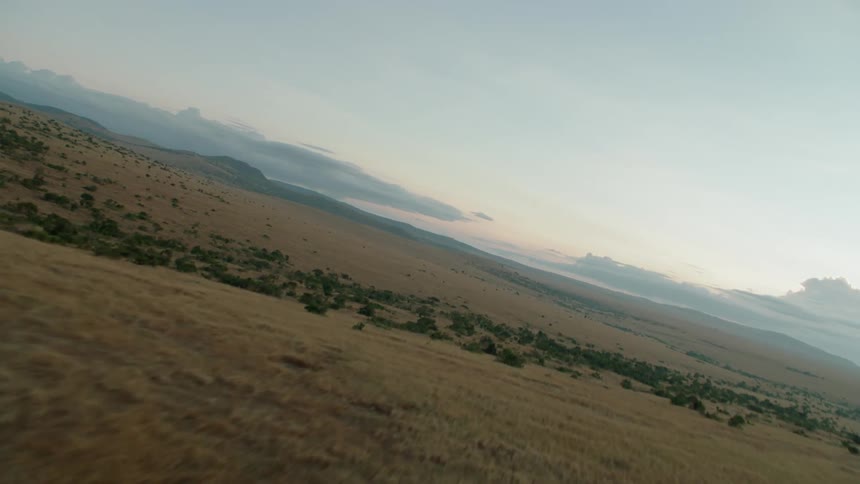 Clouds float in the distance at sunset