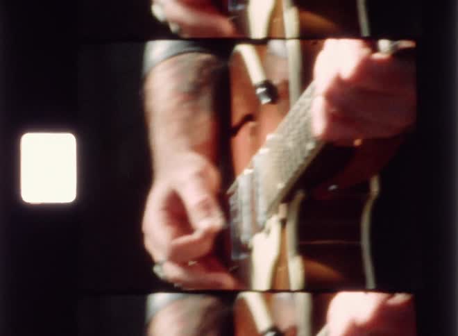 A man plays a guitar