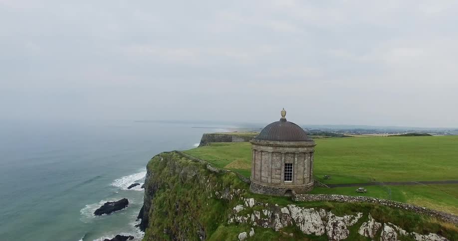 A building sits on a seaside cliff