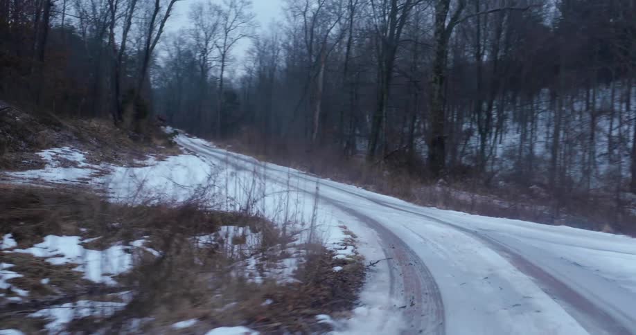 The small road is covered with snow