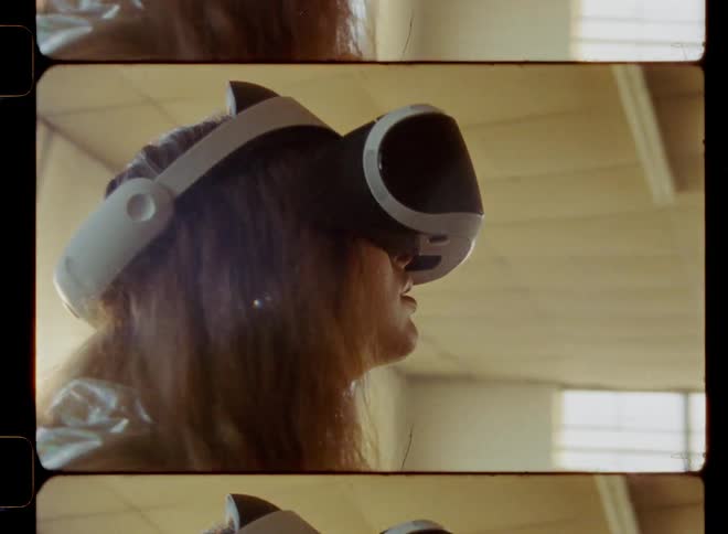 A woman is using a virtual reality headset