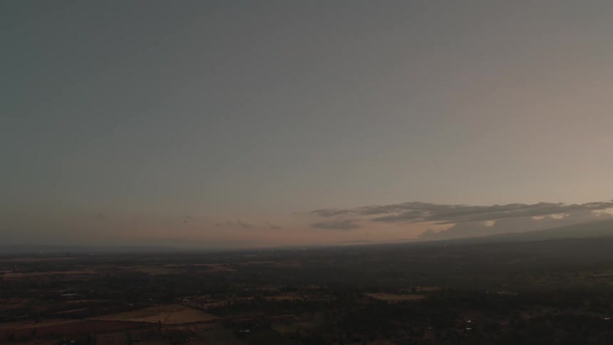 Clouds float in the sky at sunset