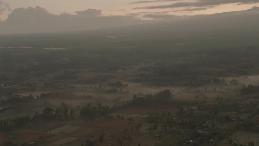 There is fog all over the fields below