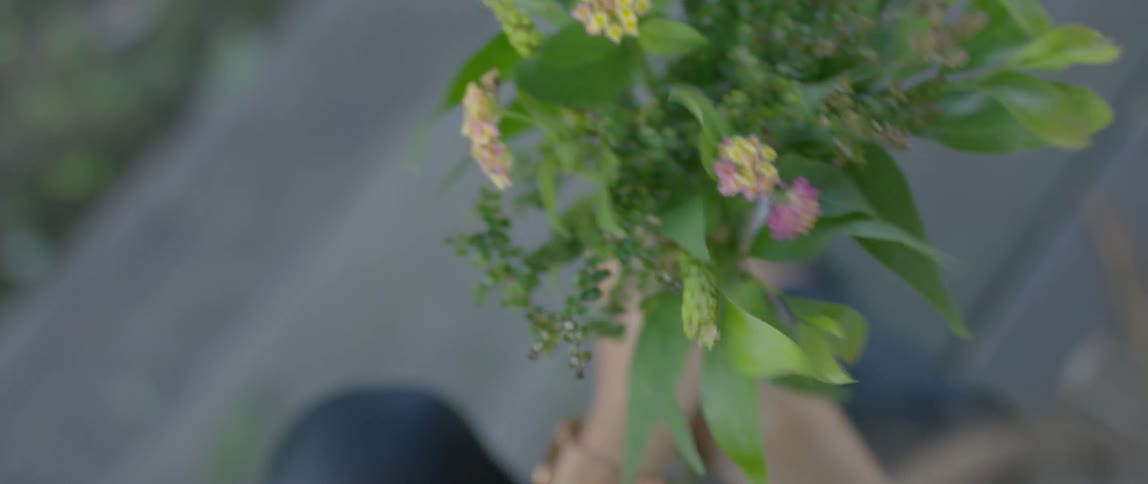 Woman fixing a bouquet in her hands